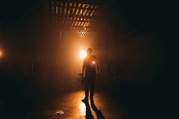 silhouette photography of man inside building